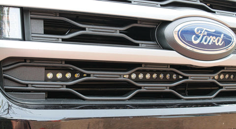 up close view of ford expedition with behind grille led light bar for off roading