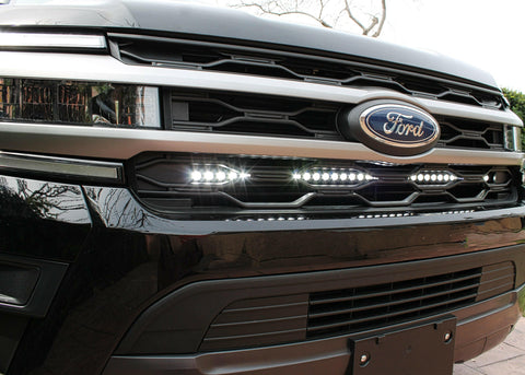up close view black ford expedition with behind grille led light bar color white for off roading