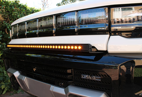 white 2024 hummer ev with amber 40in light bar in the front