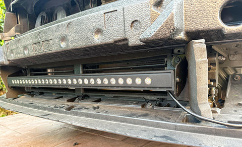 subaru outback behind grille with led light bar off roadi