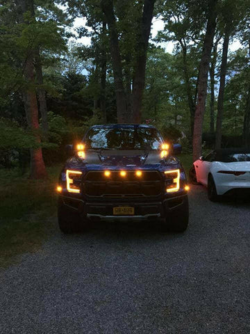 red ford raptor generation 2 2019 2020 with off roading 40watt square ditch lights in the dark