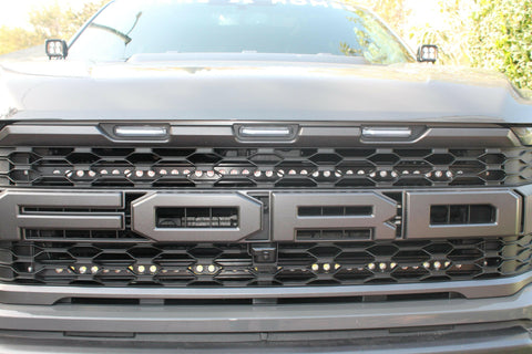 u[ close view of 2021 22021 2022 2023 ford raptor generation 3 grille with off roading light bars behind