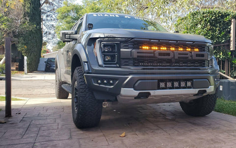 gray 2021 2022 2023 ford raptor generation 3 with one amber light bar behind the grille 