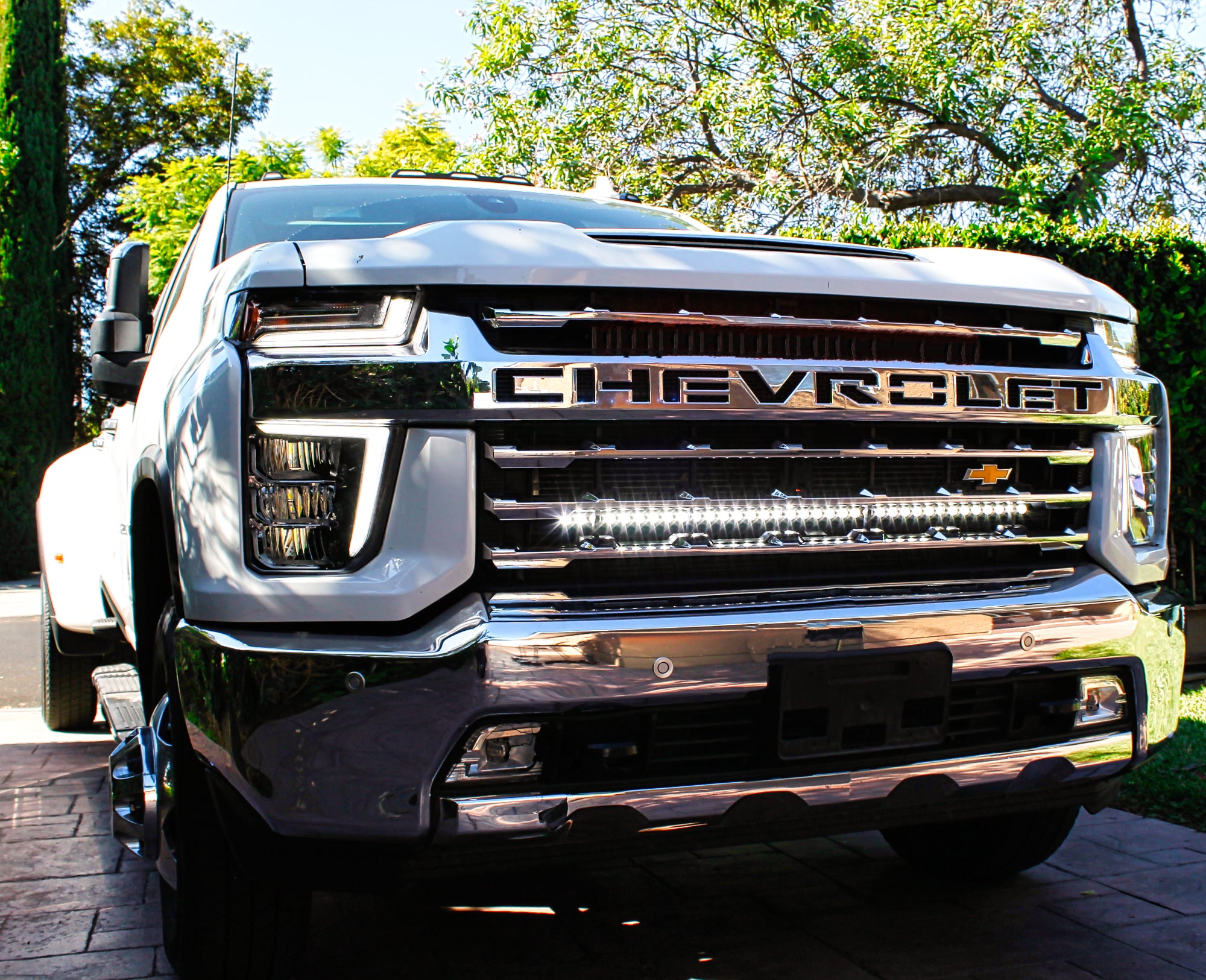 2020 2021 2022 2023 white Chevrolet Silverado 2500/3500HD one white 40in Light Bar behind the grille by M&R Automotive