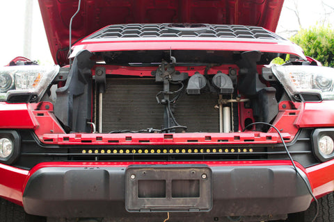 2020 2021 2022 2023 red Toyota Tacoma with 30in light bar showing black metal bracket