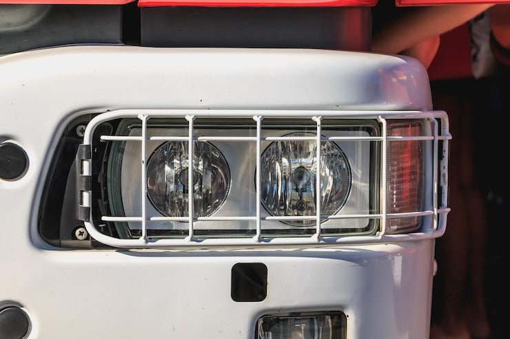 Top Light Bar Options for Your Favourite Trucks - close-up of a truck headlight with protective metal grille