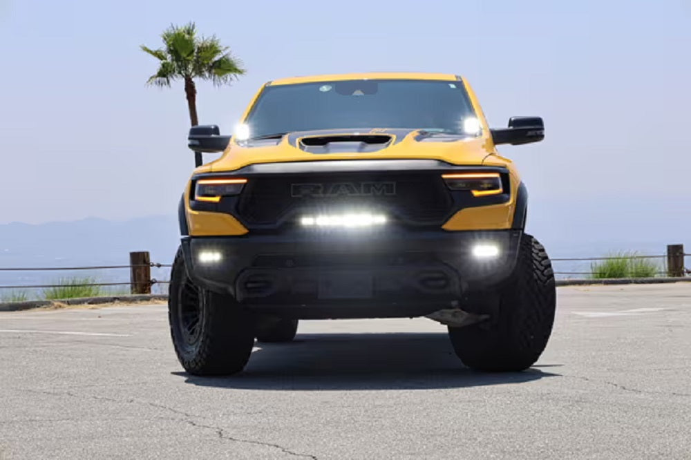Combining Style and Functionality with Custom Light Bars: Yellow off-road truck with bold custom light bars for enhanced visibility and aggressive look