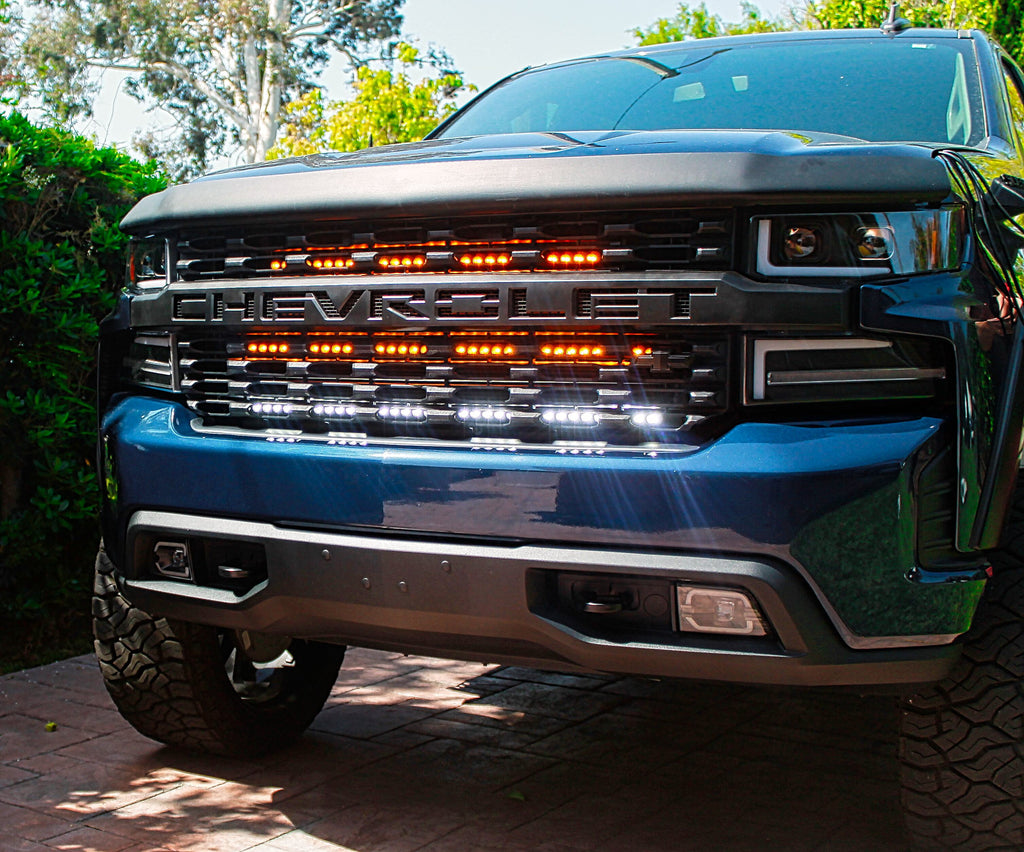 2019 blue chevrolet colorado with light bars behind the grille for off roading