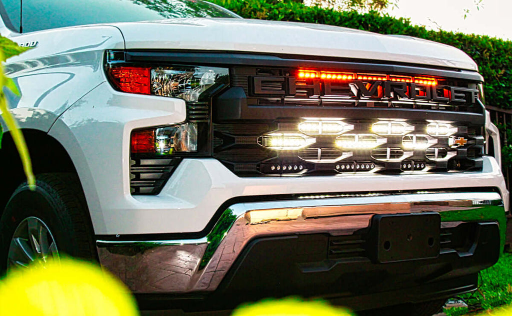 2022 2023 2024 white Chevrolet Silverado 1500 with amber 30in light bar and two white 40in light bars behind the grille by M&R automotive