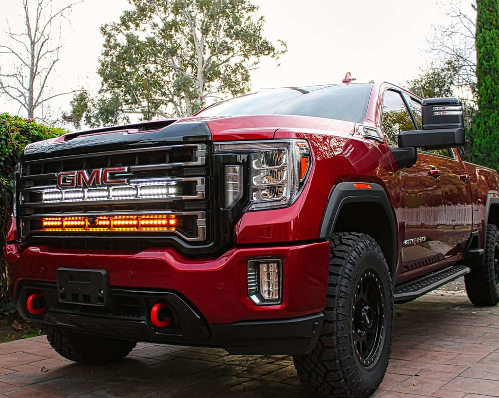 2020 2022 2022 2023 red GMC Sierra 2500HD with two 40in light bars behind the grille color amber and white by M&R automotive