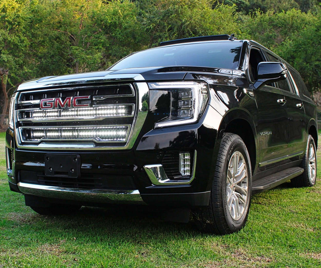 2021 2022 2023 2024 black gmc yukon with two white 40in light bars behind the grille by M&R automotive