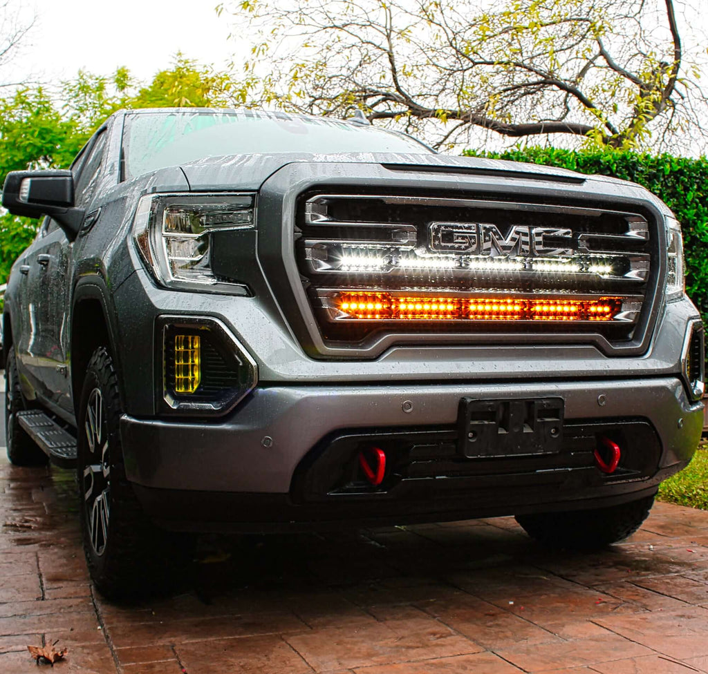 2020 2021 2022 2023 gray GMC Sierra 1500 with two 40in light bars color amber and white behind the grille by M&R automotive