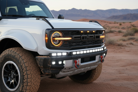 2022 white ford bronco with light bars on the bumper for off roading