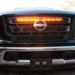 black nissan titan with one led light bar behind the grille in amber color for off roading