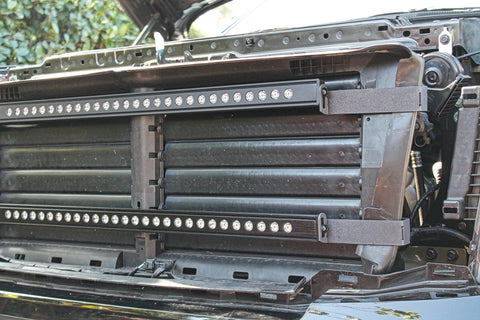 nissan titan grille off showing two led light bars and metal brackets for off roading
