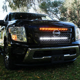 black nissan titan with off road led light bars behind the grille