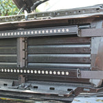 nissan titan grille off showing two led light bars and metal brackets for off roading