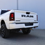 RAM 2500 Reverse Light Kit installed on white 2025 RAM 2500 truck rear bumper with illuminated LED reverse pods