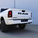 RAM 2500 Reverse Light Kit installed on white 2025 RAM 2500 truck rear bumper with illuminated LED reverse pods