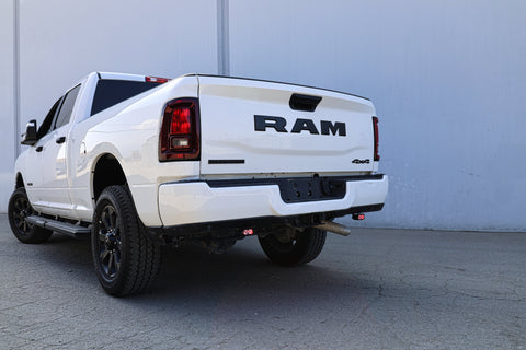 RAM 2500 Reverse Light Kit installed on white 2025 RAM 2500 truck rear bumper with illuminated LED reverse pods