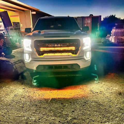 2019 2020 2021 2022 2023 white GMC Sierra 1500 with two amber 40in behind grille light bars
