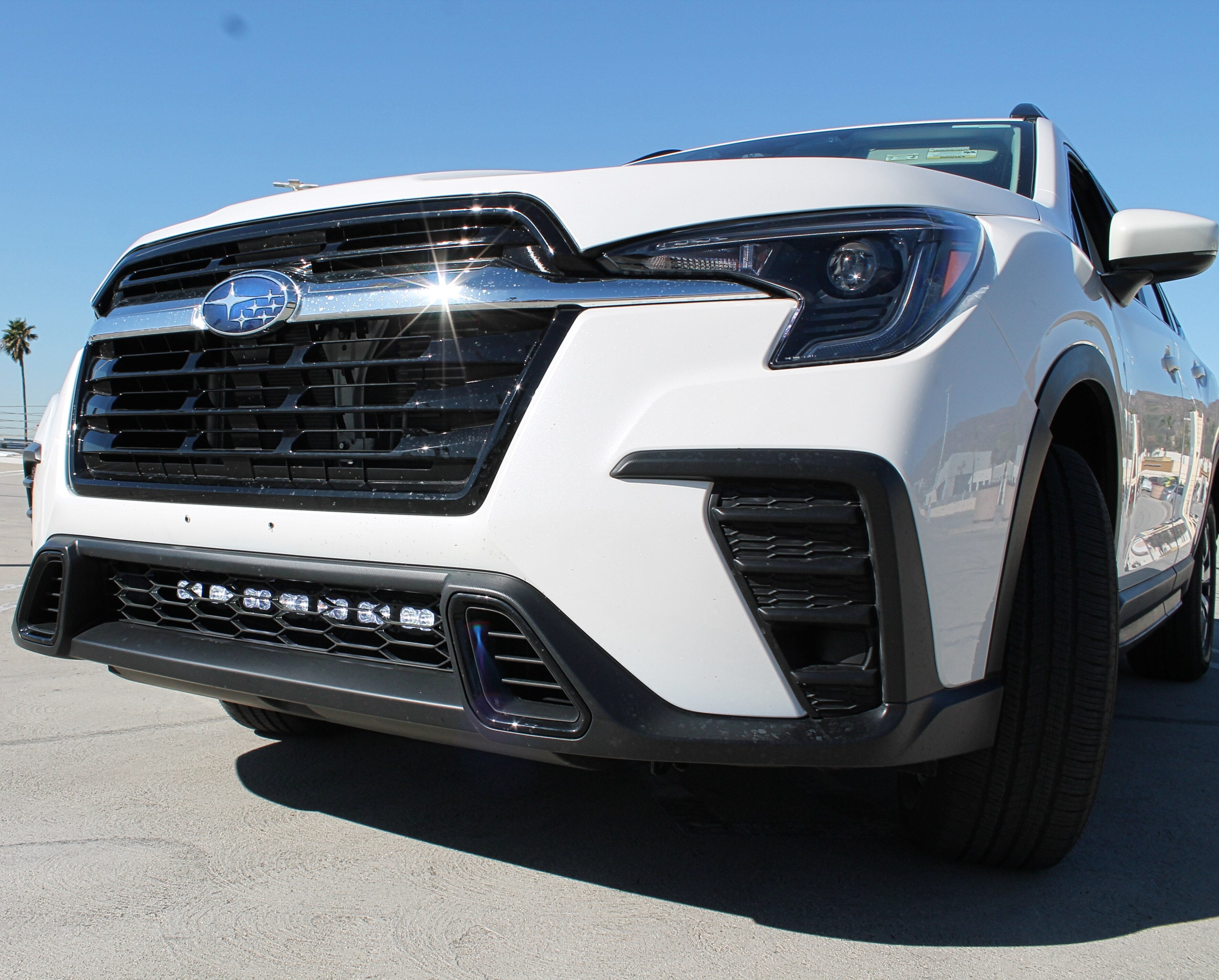Subaru Ascent Light Bar featuring a white SUV front view with bold grille and black accents, showcasing the rugged exterior