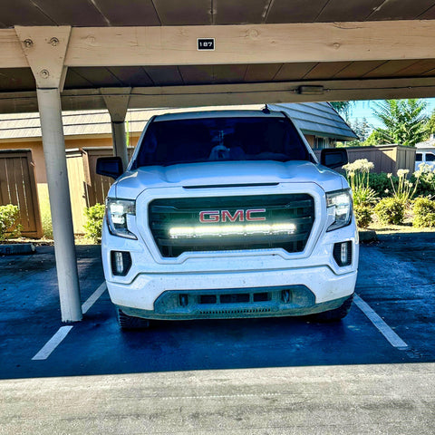 2019 2020 2021 2022 2023 white GMC Sierra 1500 with one white 40in Light Bar behind the grille