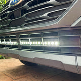 grey subaru outback with led light bar off roading
