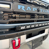 Ford Bronco Raptor 30in Light Bar on front bumper with mounted LED bar, black powder-coated bracket, Raptor badge visible, rugged off-road setup