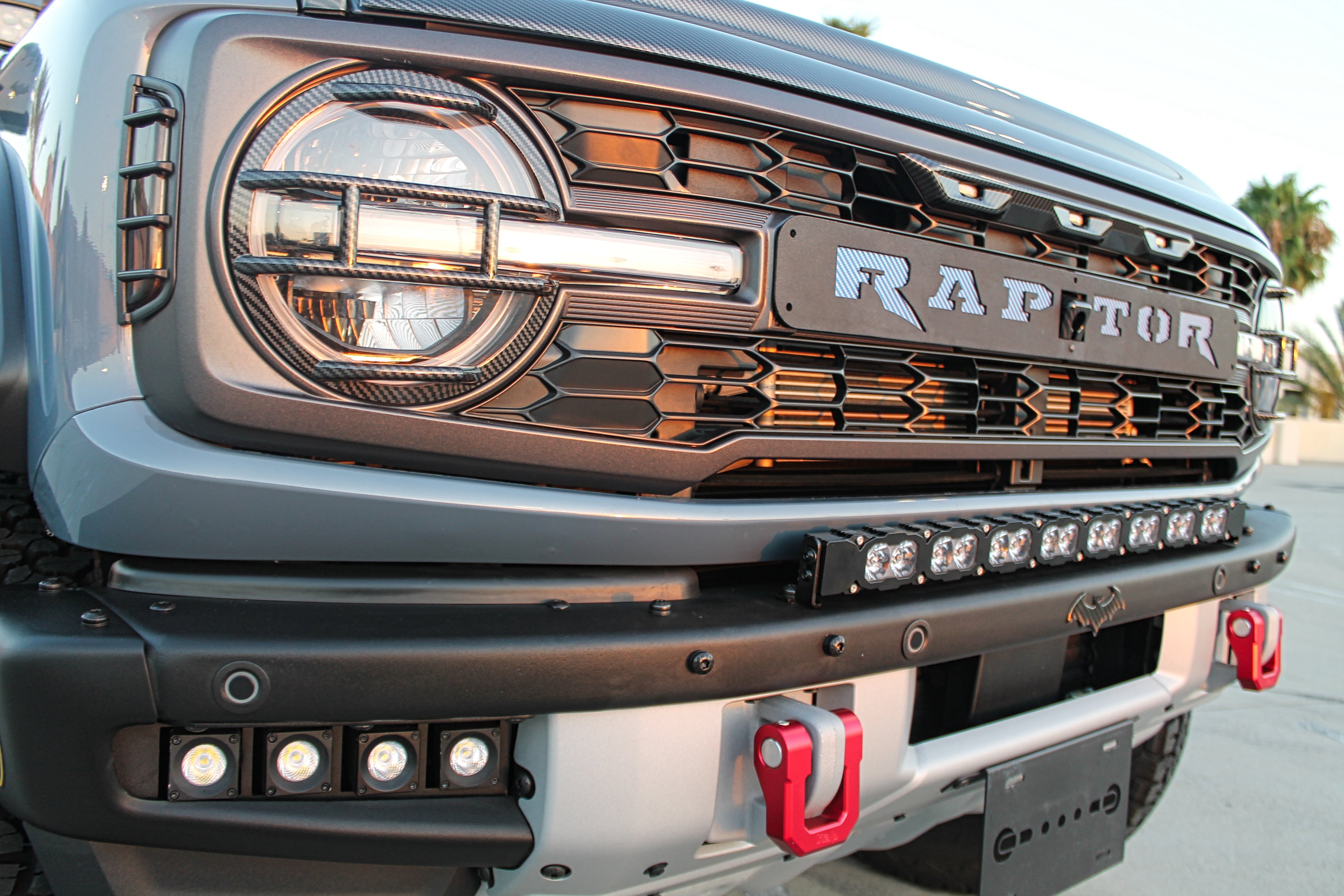 Ford Bronco Raptor 30in Light Bar installed on 2021+ model with black powder-coated bracket and sleek bumper-mounted setup