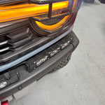 Ford Bronco Raptor Light Bar extension installed on 2021+ with 12in PRO side light bars, fits modular bumper—front view showing header and amber LEDs