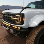 Bronco Raptor Lightbar kit: 40in curved LED light bar with 12in extension on a Ford Bronco Raptor (2021+), slim bumper-mounted, powder-coated black metal bracket for a sleek built-in look
