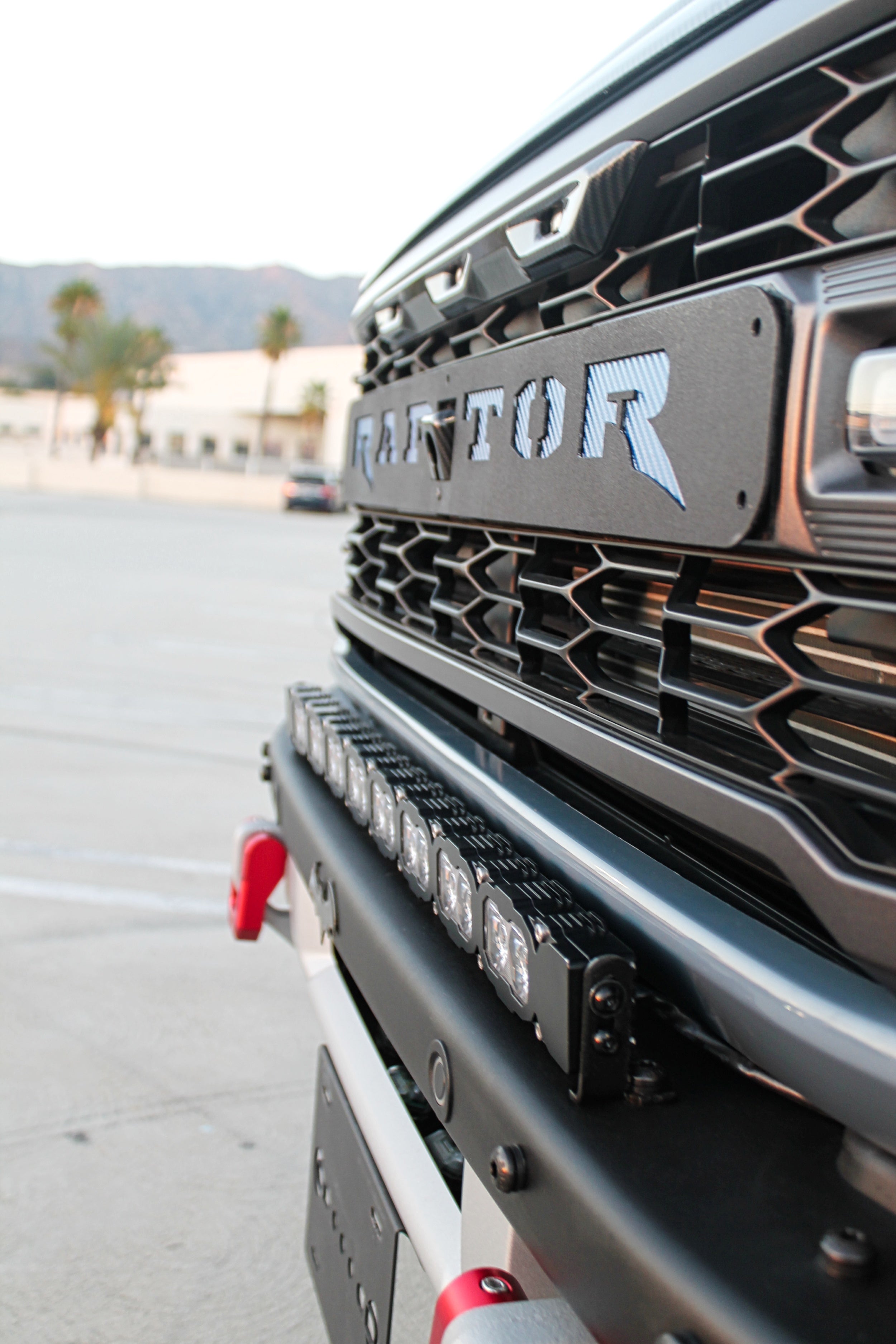Ford Bronco Raptor 30in Light Bar image on front grille close-up with rugged bumper and Raptor branding