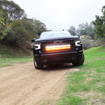 Black Chevrolet Silverado 1500 with dual 40in off-road LED light bars in the grille
