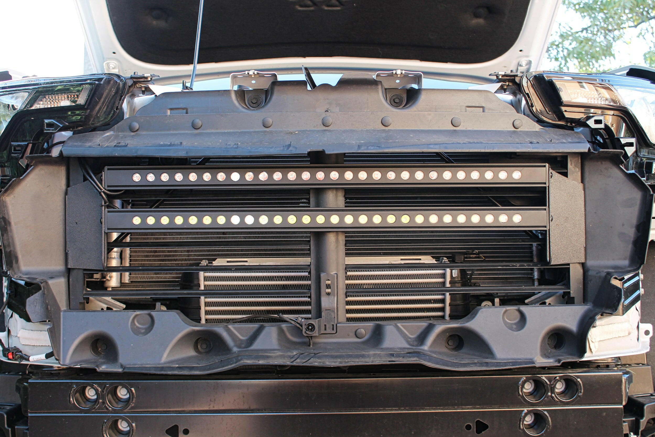 2023 2024 white chevrolet colorado with behind grille 30in light bars grille off