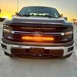 Ford F150 ditch lights on 2024+ hood mount with amber DRL backglow and white main LEDs for Ford F150 ditch lights
