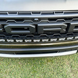 curved LED light bar in front grille of 2024 ford ranger raptor