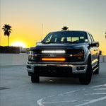 Ford F150 hood-mount ditch lights with amber DRL backglow, product view for 2024+ F150