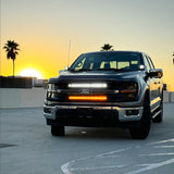 Ford F150 hood-mount ditch lights with amber DRL backglow, product view for 2024+ F150