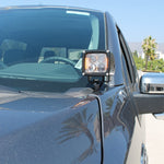 Ford F150 hood-mount ditch lights with amber DRL backglow, side view on a 2024+ F150