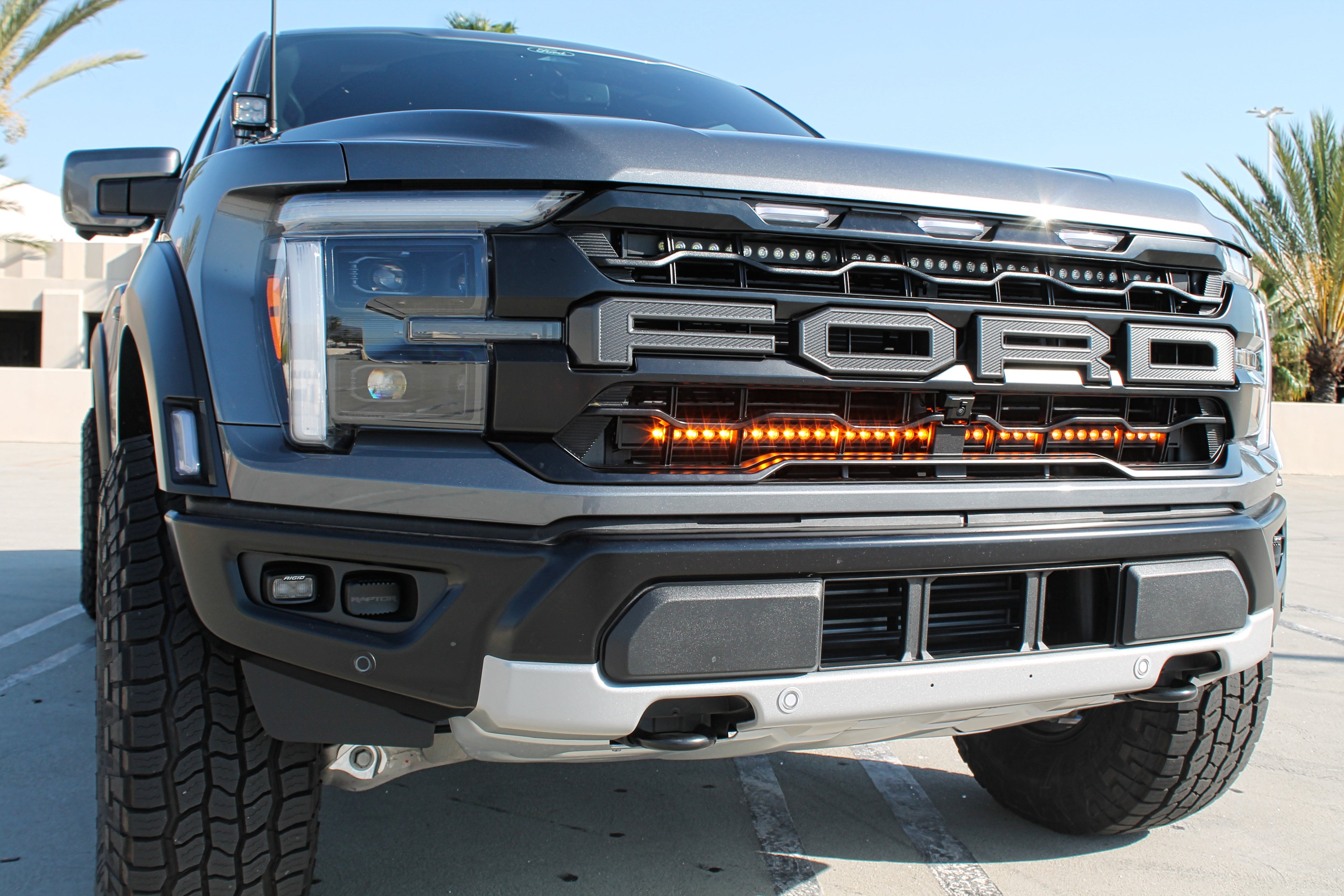 2024+ Ford Raptor ditch lights Gen 3 Refresh A-Pillars on front grille view with amber DRL and white LED dual-function lights