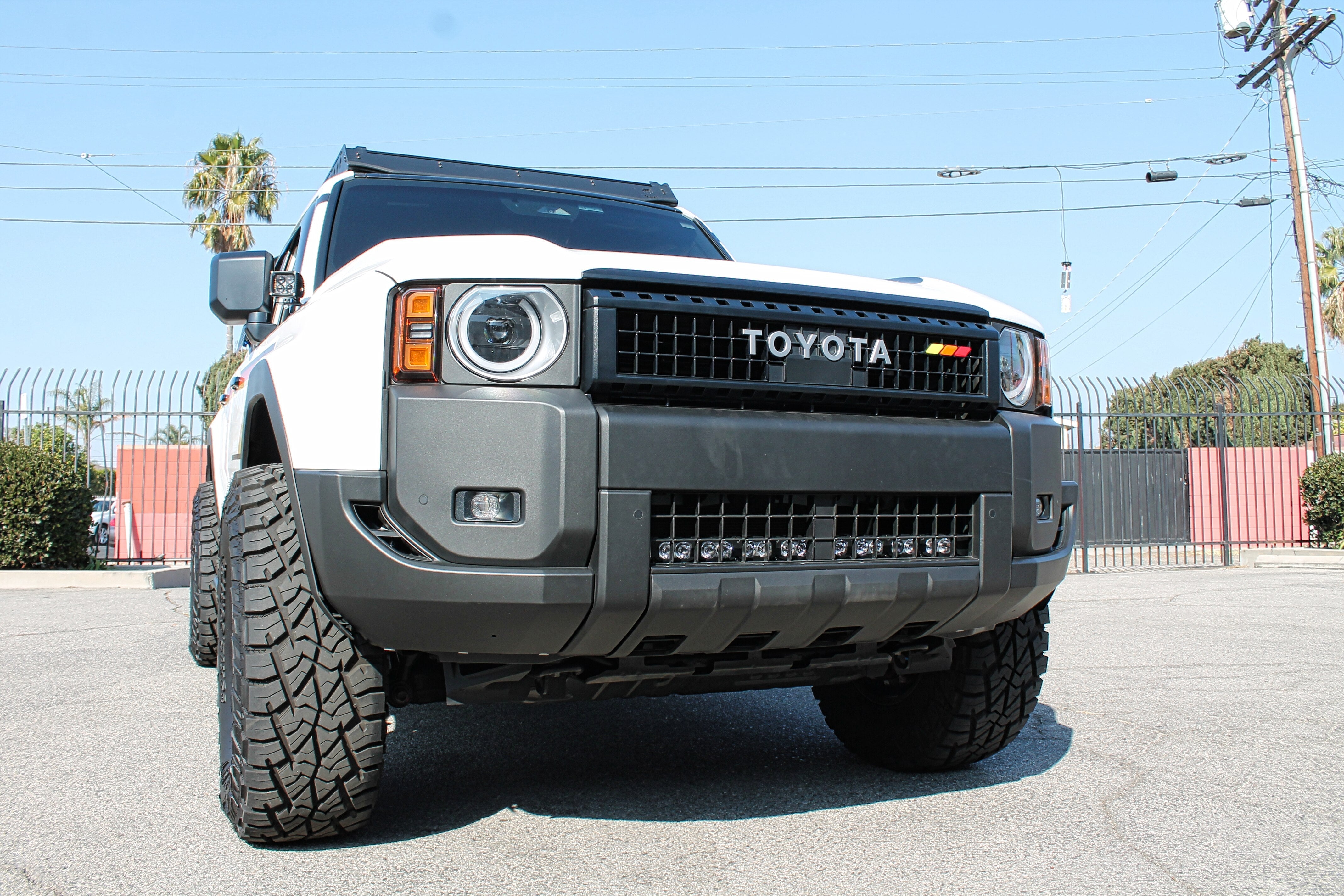 Land Cruiser light bar in front view on 2024+ Toyota Land Cruiser — installation behind lower grille, front grille removal required