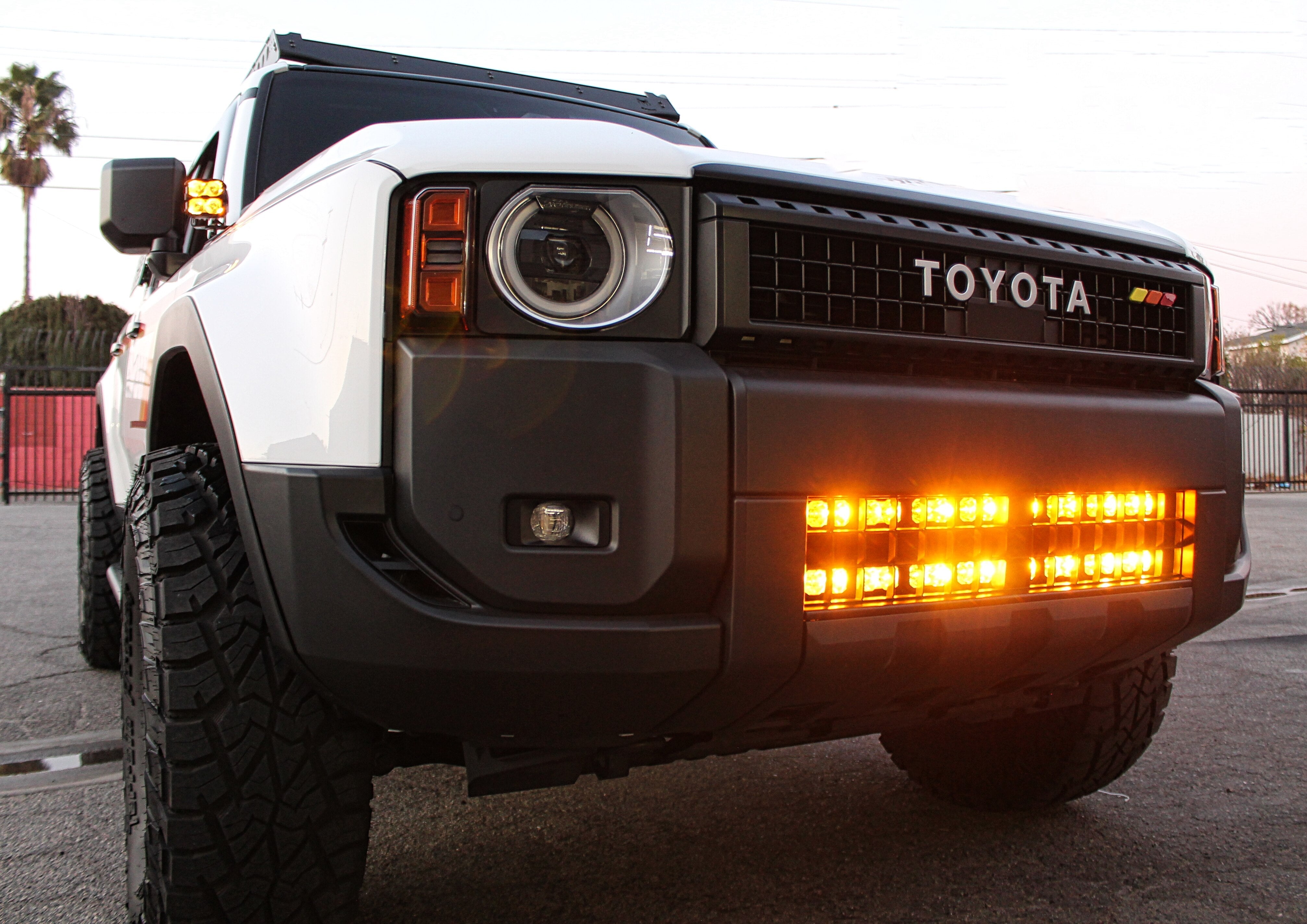 Land Cruiser Light bars on 2024+ Toyota Land Cruiser with front grille removed showing LED light bar for enhanced off-road visibility