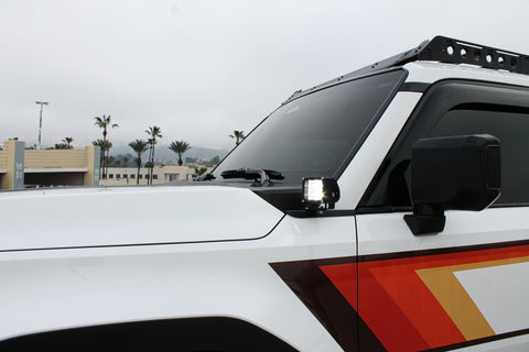 Land Cruiser ditch lights on 2024+ Toyota Land Cruiser, dual color white LED with amber DRL backglow on side of rugged SUV