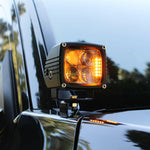 upclose ditch light on new black 2024 toyota tacoma amber light light pillars