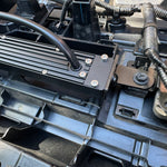 behind grille of new toyota tacoma 2024 showing metal bracket for led light bars 