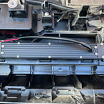behind grille of new toyota tacoma 2024 showing 10in light bar set up 