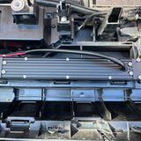 behind grille of new toyota tacoma 2024 showing 10in light bar set up 