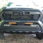 front view gray new toyota tacoma with led light bars behind grille and hood mount kit