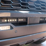 upclose view gray 2024 toyota tacoma led light bar behind grille 